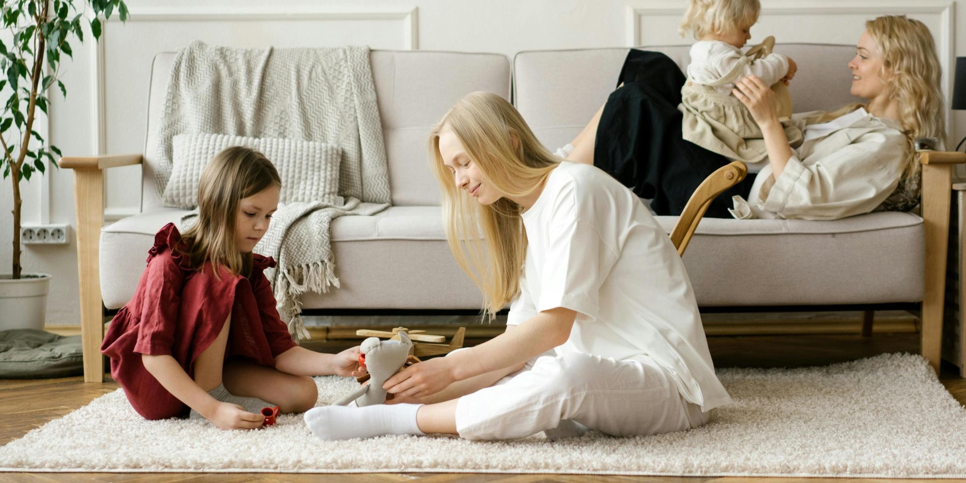 A family enjoys quality time together in a modern living room, promoting warmth and connection.